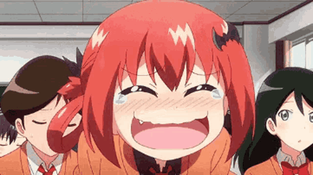 a girl with red hair and a bat on her head is laughing and crying