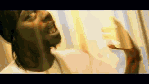 a close up of a man 's face with a blurred background