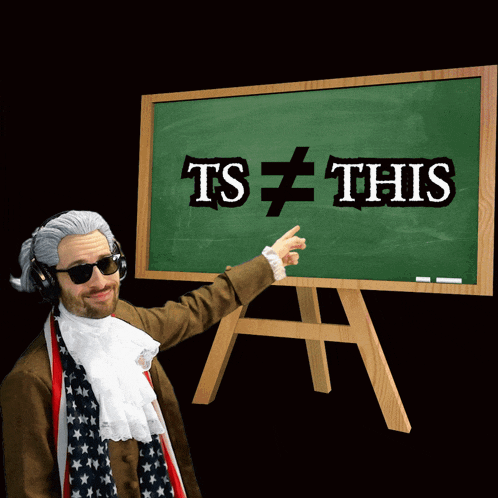 a man points to a blackboard that says ts this