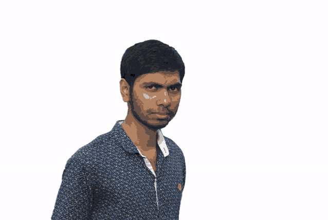 a man in a blue shirt with a white collar