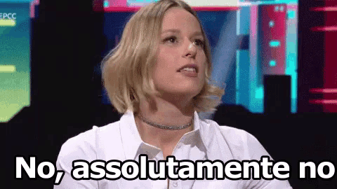a woman in a white shirt is saying no , absolutely no .