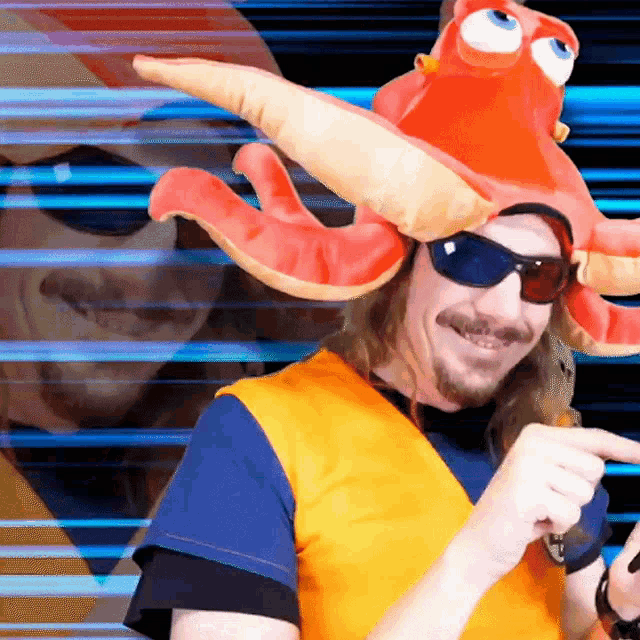 a man wearing a stuffed octopus hat and sunglasses