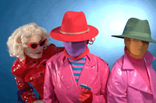 a woman in a red hat stands between two other women
