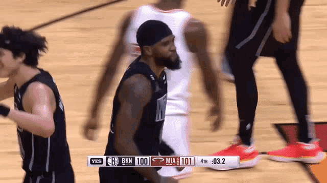 a basketball game between miami and bkn is being played