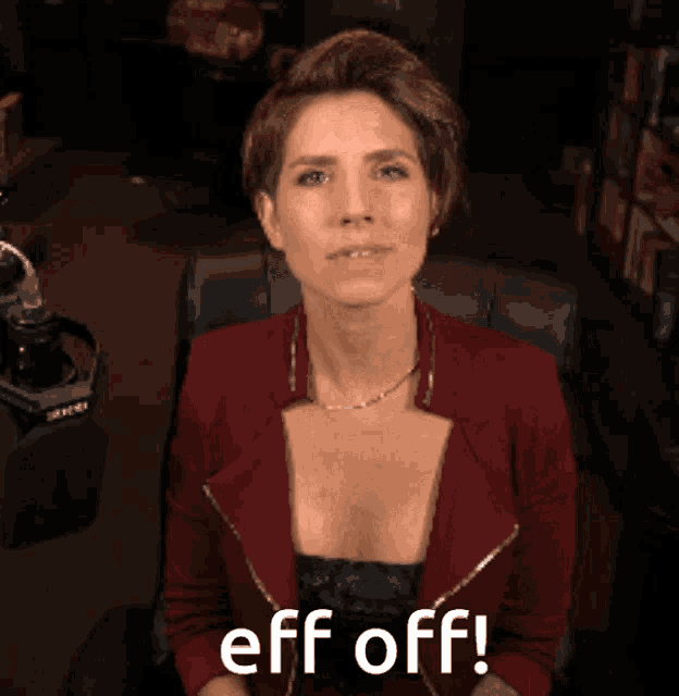 a woman in a red jacket says " eff off "
