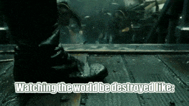 a person standing on a wooden floor with the words " watching the world be destroyed like " above them