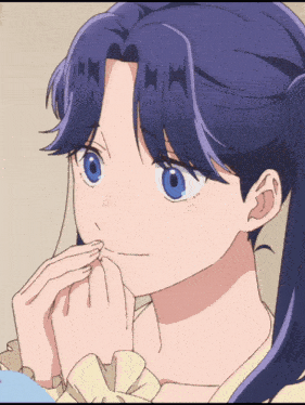 a close up of a girl 's face with blue hair