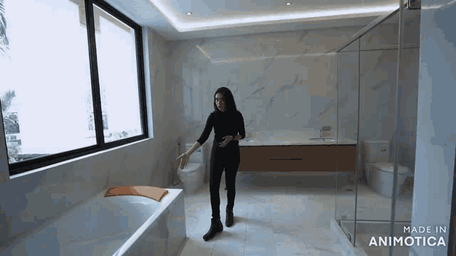 a woman is standing in a bathroom with the words made in animotica at the bottom