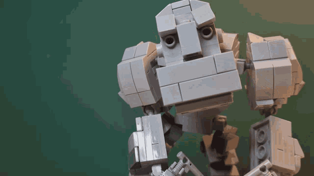 a robot made out of lego bricks with a face on it