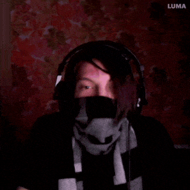 a person wearing headphones and a scarf with the word luma behind them