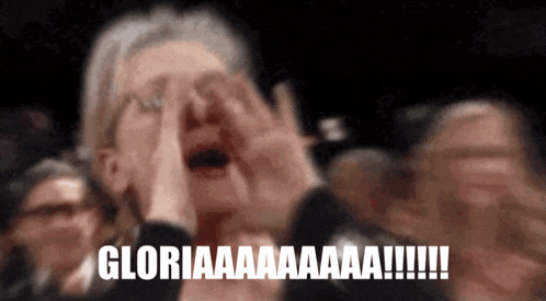 a woman is screaming in a crowd and the words gloria are on the bottom