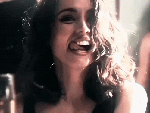 a close up of a woman 's face with a smile on her face