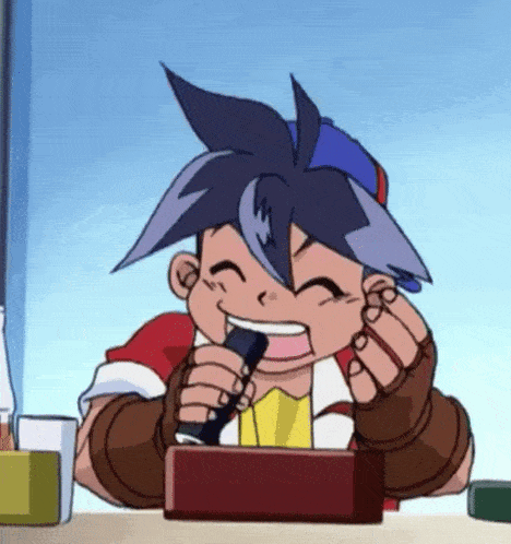a cartoon boy is sitting at a table holding a microphone and smiling .