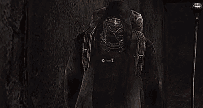a person is riding a horse in a dark room with a large bag on their back .