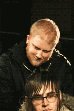 a man and a woman are looking at each other with the words lesbianforfrank above them