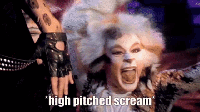 a woman in a cat costume is screaming with the words high pitched scream written below her
