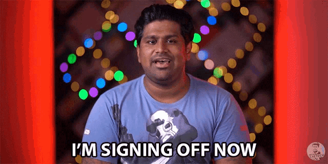 a man in a blue shirt is signing off now