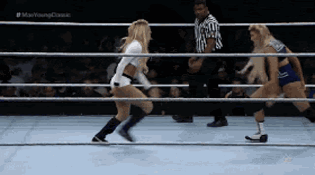 two women are wrestling in a ring with the words max young classic on the bottom right