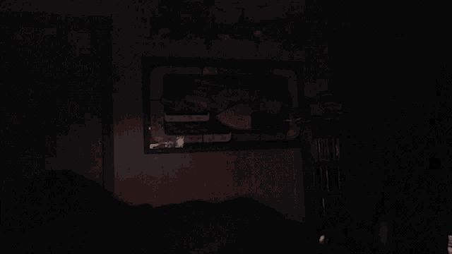 a dark room with a picture on the wall that says ' a '