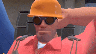 a man wearing a hard hat and goggles has his hand behind his head
