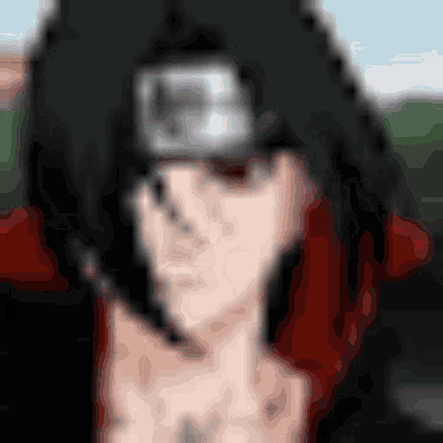 a blurry picture of a person wearing a headband with the letter h on it