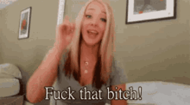 a woman is giving the middle finger and saying fuck that bitch