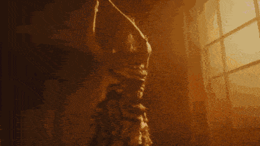 a pixelated image of a woman in a dress holding a sword