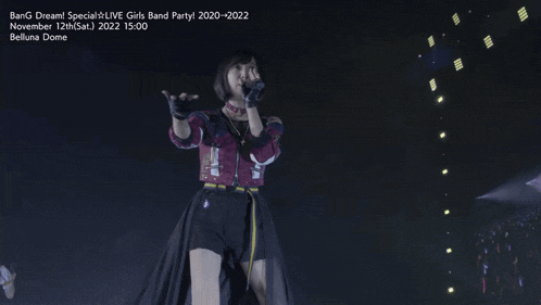 two girls singing in front of a sign that says bang dream special live girls band partyl 2020-2022