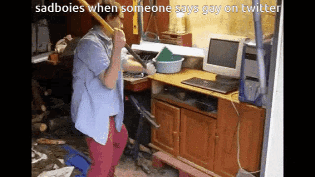 a man holding a shovel in front of a computer with the caption sadboies when someone says gay on twitter ..