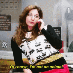 a woman talking on a cell phone with the words of course i 'm not an animal below her