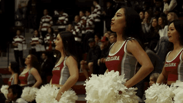 a group of cheerleaders are wearing shirts that say victoria clara