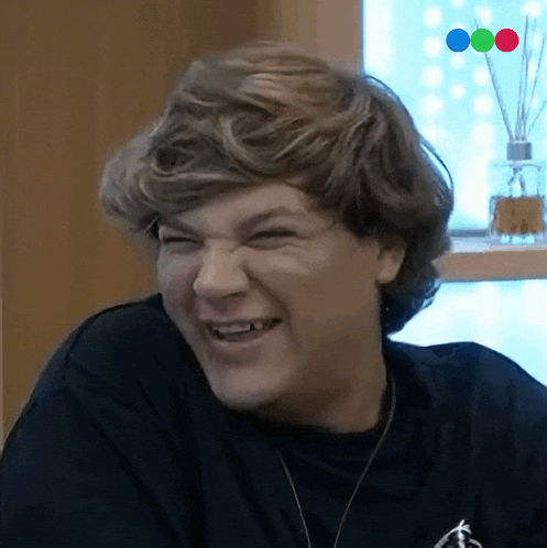 a close up of a person making a funny face with three circles in the background