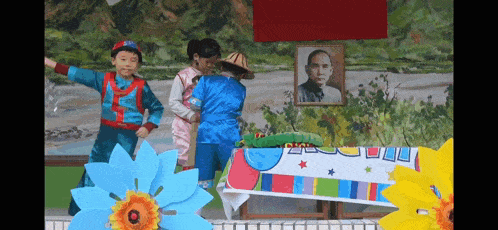 a group of children are standing in front of a painting of a man