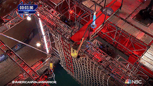 an aerial view of an american ninja warrior competition with a time of 00:33