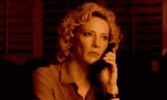 a woman is talking on a cell phone and the words puree are on the screen