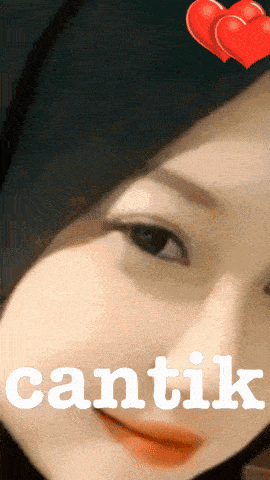 a close up of a woman 's face with the word cantik in white