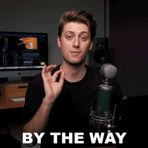 a man in front of a microphone with by the way written on the bottom