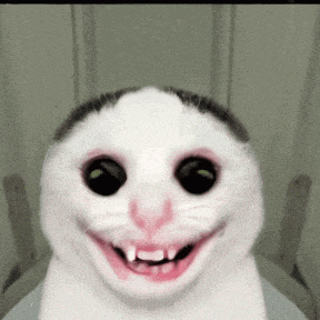 a close up of a cat 's face with its mouth open and teeth showing