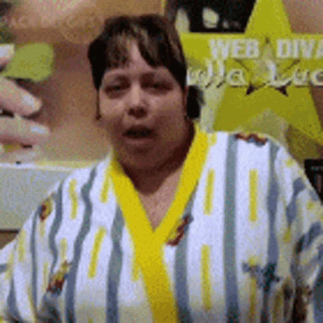 a woman in a striped robe is standing in front of a sign that says web design
