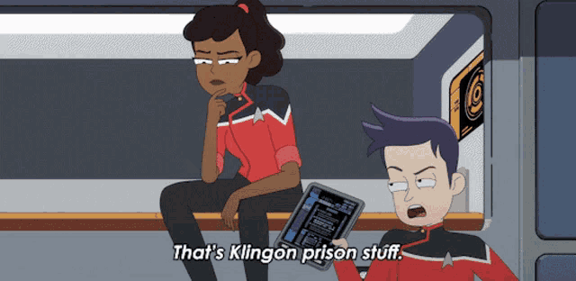 a cartoon of a man holding a tablet and a woman sitting next to him saying that 's klingon prison stuff