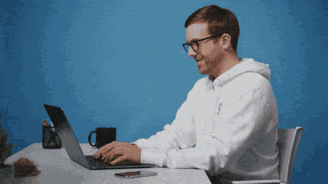 a man in a white sweatshirt with the letter s on it
