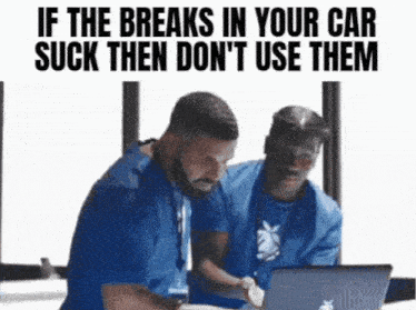 two men in blue scrubs are looking at a laptop with the caption if the breaks in your car suck then don 't use them