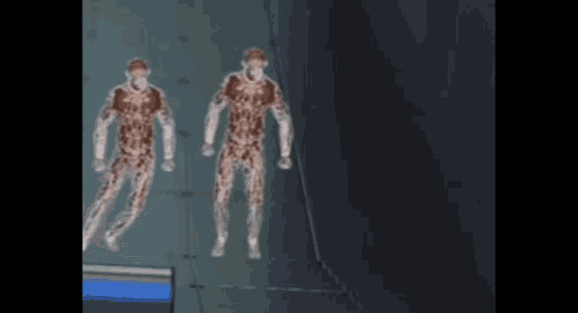 a blurred image of two people standing next to each other in a dark room