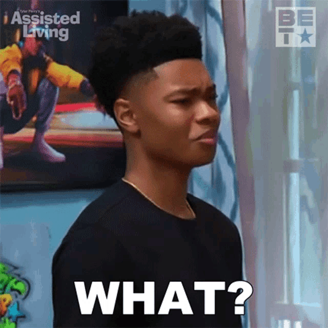 a young man is making a face and asking what .