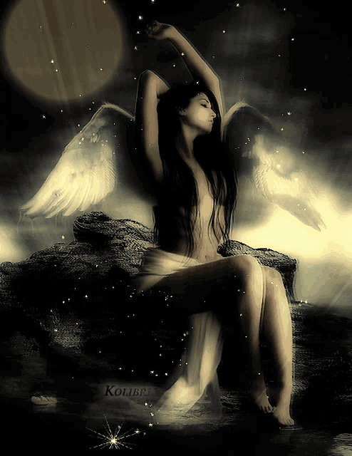 a naked woman with angel wings sits on a rock in the dark