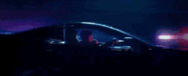 a pixelated image of a car with a purple light coming out of the roof