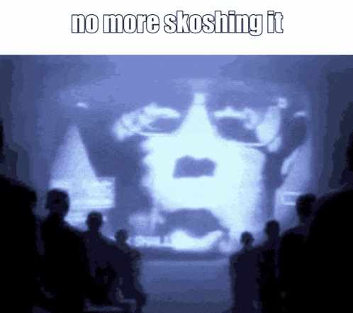 a group of people looking at a screen with the words no more skoshing it