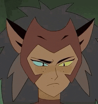 catra from she ra and the princesses of power is making a funny face with her eyes closed .