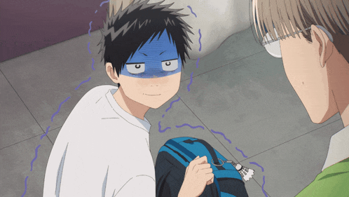a boy with a blue mask on his face is sitting next to a man with glasses