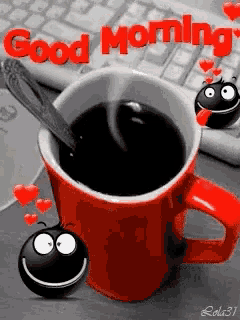 a red cup of coffee with a spoon in it and the words good morning written on it